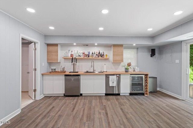 1920 Quail Ridge Rd, Raleigh, NC 27609 - indoor wet bar featuring wine cooler, wood finished floors, decorative backsplash, stainless steel dishwasher, and recessed lighting