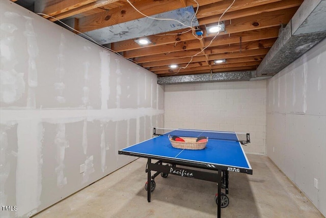 1920 Quail Ridge Rd, Raleigh, NC 27609 - game room featuring unfinished concrete floors and concrete block wall