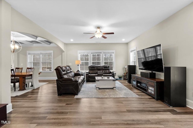 2981 Thurman Dairy, Wake Forest, NC 27587 - living area featuring recessed lighting, wood finished floors, a chandelier, ceiling fan, and arched walkways