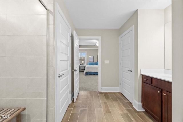 2981 Thurman Dairy, Wake Forest, NC 27587 - bathroom featuring vanity, ensuite bathroom, wood finished floors, and a tile shower