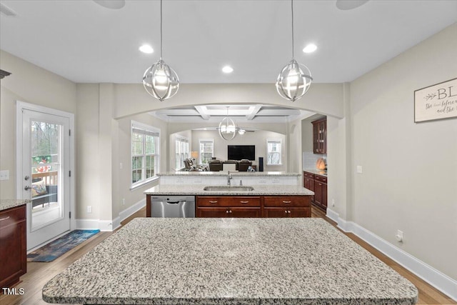 2981 Thurman Dairy, Wake Forest, NC 27587 - kitchen with a center island with sink, dishwasher, arched walkways, open floor plan, and recessed lighting