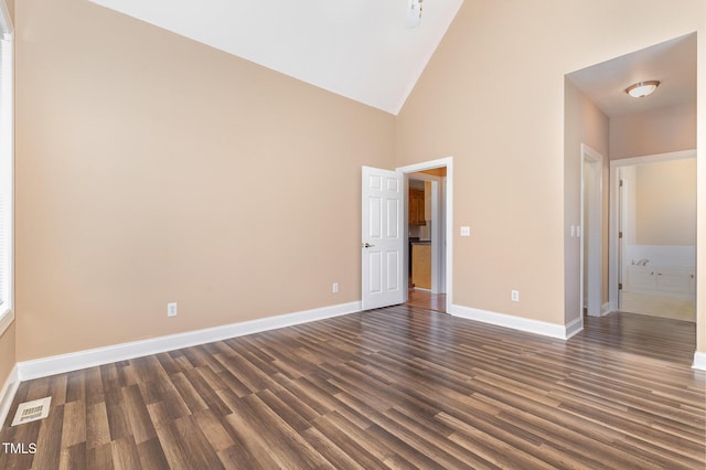 145 Adams Pointe Ct, Angier, NC 27501 - unfurnished bedroom with dark wood-style floors and high vaulted ceiling