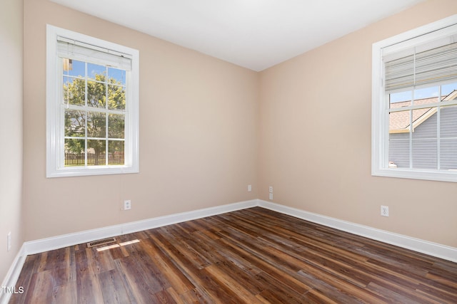 145 Adams Pointe Ct, Angier, NC 27501 - spare room with baseboards and dark wood finished floors