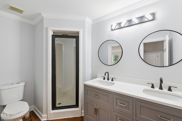 109 Grey Fox Ct, Cary, NC 27511 - bathroom with double vanity, a shower stall, ornamental molding, and wood finished floors