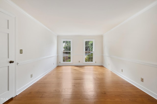 109 Grey Fox Ct, Cary, NC 27511 - spare room featuring light wood finished floors and ornamental molding