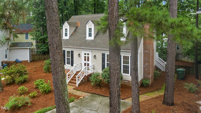 109 Grey Fox Ct, Cary, NC 27511 - cape cod-style house with roof with shingles and stairs