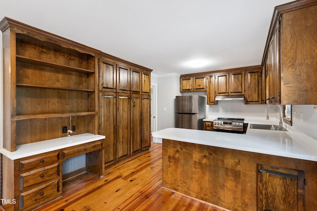 109 Grey Fox Ct, Cary, NC 27511 - kitchen with appliances with stainless steel finishes, under cabinet range hood, light wood finished floors, a peninsula, and open shelves