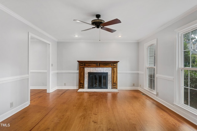 109 Grey Fox Ct, Cary, NC 27511 - unfurnished living room featuring ceiling fan, wood finished floors, a glass covered fireplace, recessed lighting, and ornamental molding