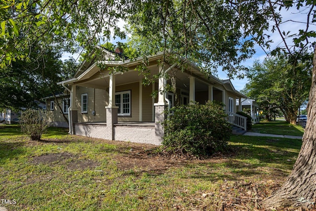112 N Sellers St, Selma, NC 27576 - view of home's exterior featuring a porch and a lawn