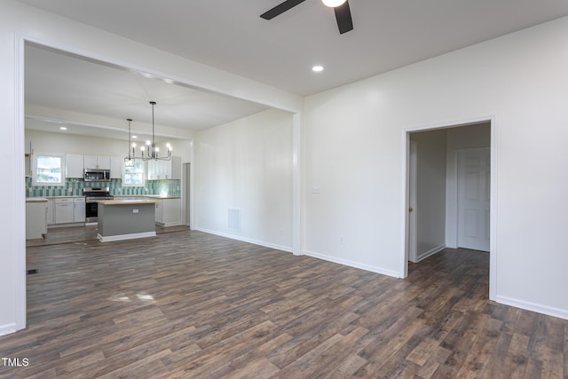 112 N Sellers St, Selma, NC 27576 - unfurnished living room featuring a ceiling fan, dark wood-style flooring, a chandelier, and recessed lighting