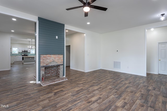 112 N Sellers St, Selma, NC 27576 - unfurnished living room featuring ceiling fan, dark wood-style floors, recessed lighting, a fireplace, and a chandelier