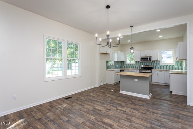 112 N Sellers St, Selma, NC 27576 - kitchen with stainless steel appliances, wood counters, decorative backsplash, dark wood-style floors, and recessed lighting