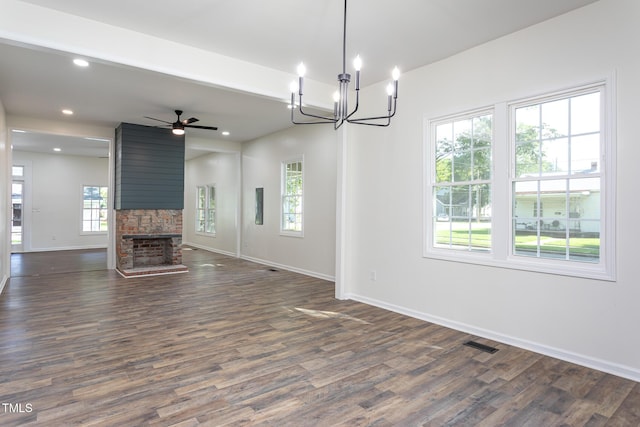 112 N Sellers St, Selma, NC 27576 - unfurnished living room featuring dark wood-style flooring, a large fireplace, a chandelier, a ceiling fan, and recessed lighting