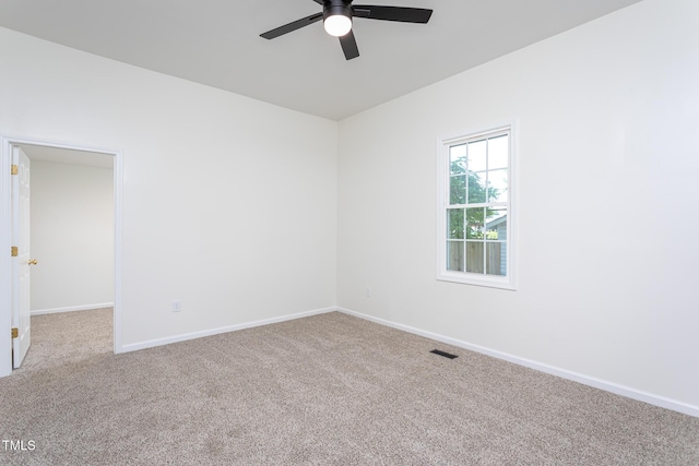112 N Sellers St, Selma, NC 27576 - spare room featuring ceiling fan and carpet