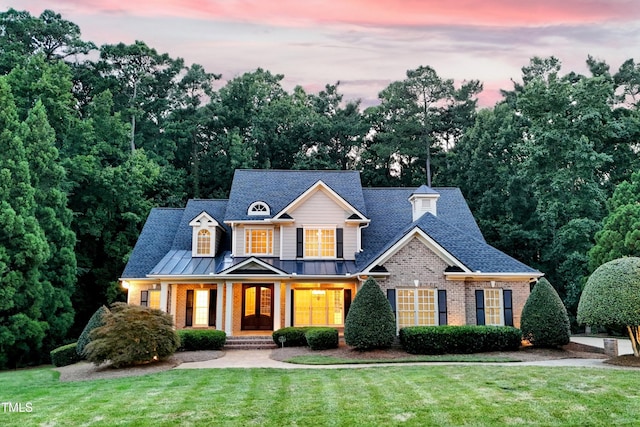 3728 Westbury Lake Dr, Raleigh, NC 27603 - view of front facade with brick siding, a front lawn, and roof with shingles