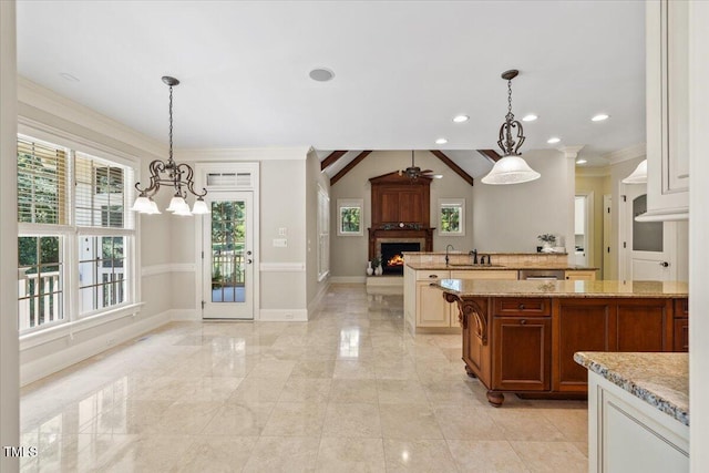 3728 Westbury Lake Dr, Raleigh, NC 27603 - kitchen with a chandelier, open floor plan, plenty of natural light, ornamental molding, and light stone counters