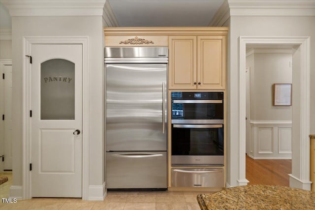 3728 Westbury Lake Dr, Raleigh, NC 27603 - kitchen with stainless steel appliances, a warming drawer, ornamental molding, and light stone counters