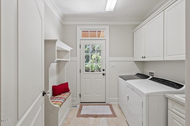 3728 Westbury Lake Dr, Raleigh, NC 27603 - laundry area with cabinet space, washing machine and dryer, wainscoting, and ornamental molding