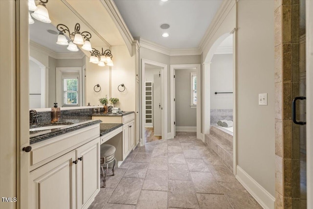 3728 Westbury Lake Dr, Raleigh, NC 27603 - full bath with vanity, a garden tub, crown molding, stone tile floors, and a stall shower