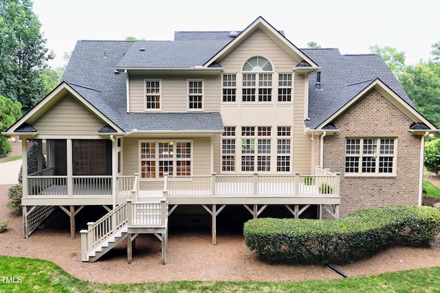 3728 Westbury Lake Dr, Raleigh, NC 27603 - rear view of property featuring a sunroom, roof with shingles, stairway, and brick siding