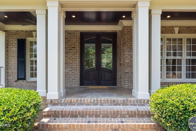 3728 Westbury Lake Dr, Raleigh, NC 27603 - property entrance featuring a porch, french doors, and brick siding