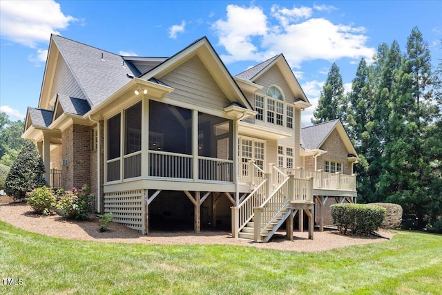 3728 Westbury Lake Dr, Raleigh, NC 27603 - rear view of house featuring brick siding, stairs, roof with shingles, a sunroom, and a yard