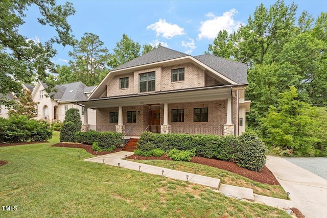 1103 Roosevelt Dr, Chapel Hill, NC 27514 - craftsman-style house featuring brick siding, a front yard, and a porch