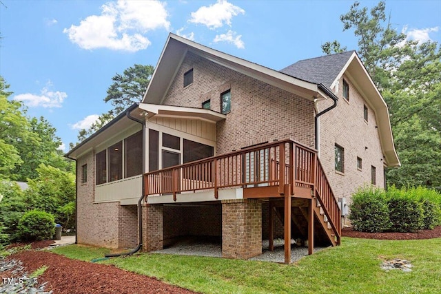 1103 Roosevelt Dr, Chapel Hill, NC 27514 - back of house featuring a garage, a deck, a sunroom, and brick siding