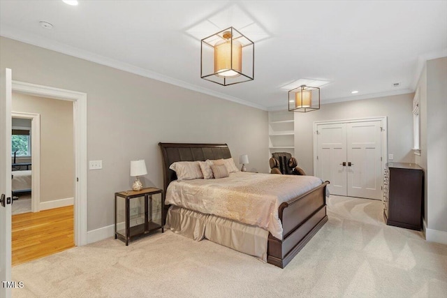1103 Roosevelt Dr, Chapel Hill, NC 27514 - bedroom featuring light colored carpet, ornamental molding, a closet, and recessed lighting