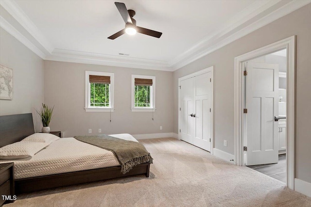 1103 Roosevelt Dr, Chapel Hill, NC 27514 - bedroom with light colored carpet, ornamental molding, ceiling fan, and ensuite bathroom