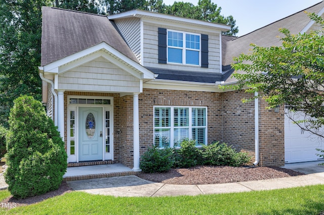 837 Varina Ln, Fuquay Varina, NC 27526 - view of front facade featuring an attached garage, roof with shingles, and brick siding