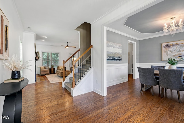 837 Varina Ln, Fuquay Varina, NC 27526 - dining room with a chandelier, wood finished floors, stairway, a ceiling fan, and a wainscoted wall