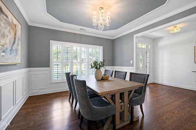 837 Varina Ln, Fuquay Varina, NC 27526 - dining space with a chandelier, dark wood-style flooring, a wainscoted wall, a tray ceiling, and crown molding
