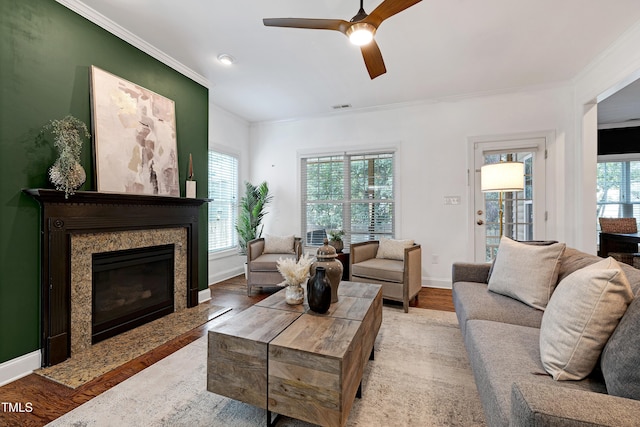 837 Varina Ln, Fuquay Varina, NC 27526 - living area featuring wood finished floors, ceiling fan, ornamental molding, and a fireplace