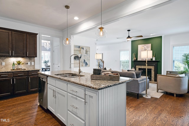 837 Varina Ln, Fuquay Varina, NC 27526 - kitchen featuring stainless steel dishwasher, dark wood-type flooring, light stone counters, dark brown cabinetry, and recessed lighting