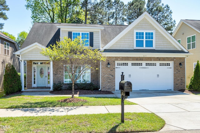 837 Varina Ln, Fuquay Varina, NC 27526 - view of front of home with brick siding, driveway, and a garage