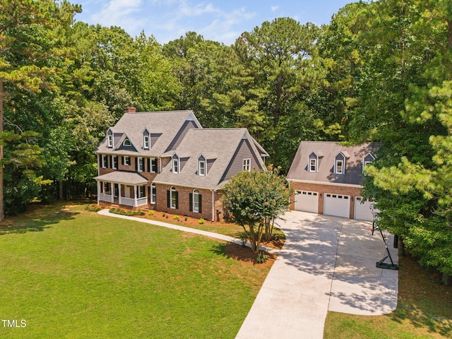 13004 Hanford Ct, Raleigh, NC 27614 - view of front facade featuring driveway, a porch, a garage, brick siding, and a chimney
