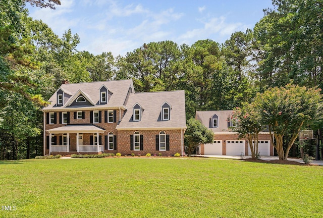 13004 Hanford Ct, Raleigh, NC 27614 - view of front of property featuring a porch, a garage, brick siding, and a front lawn