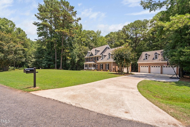 13004 Hanford Ct, Raleigh, NC 27614 - view of front of home featuring a garage, a front yard, concrete driveway, brick siding, and an outbuilding
