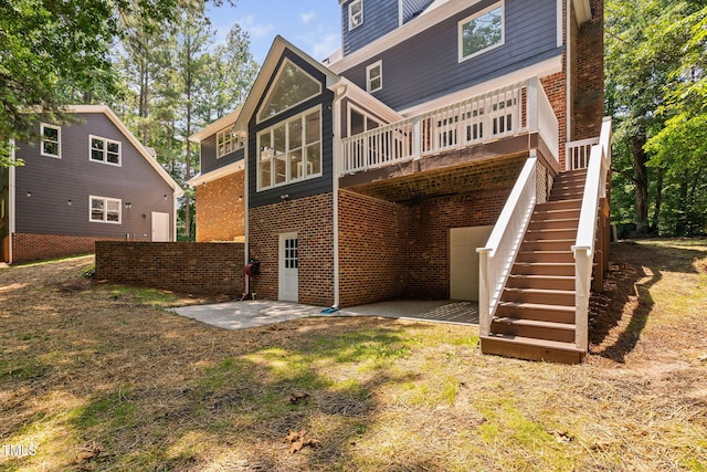 13004 Hanford Ct, Raleigh, NC 27614 - rear view of property with brick siding, a patio, stairs, and a wooden deck