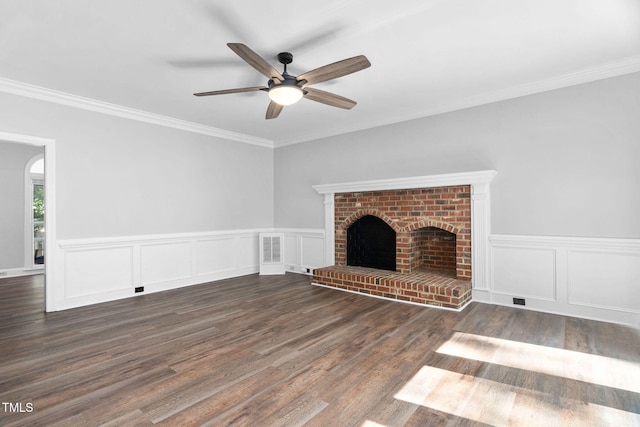 13004 Hanford Ct, Raleigh, NC 27614 - unfurnished living room with a ceiling fan, wood finished floors, ornamental molding, wainscoting, and a brick fireplace
