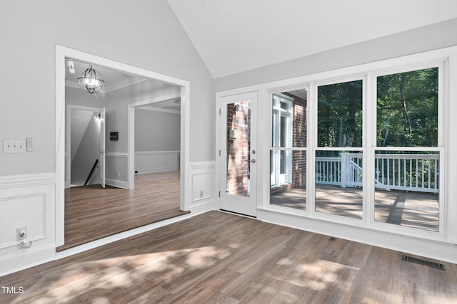 13004 Hanford Ct, Raleigh, NC 27614 - entryway featuring lofted ceiling, healthy amount of natural light, wood finished floors, ornamental molding, and a decorative wall