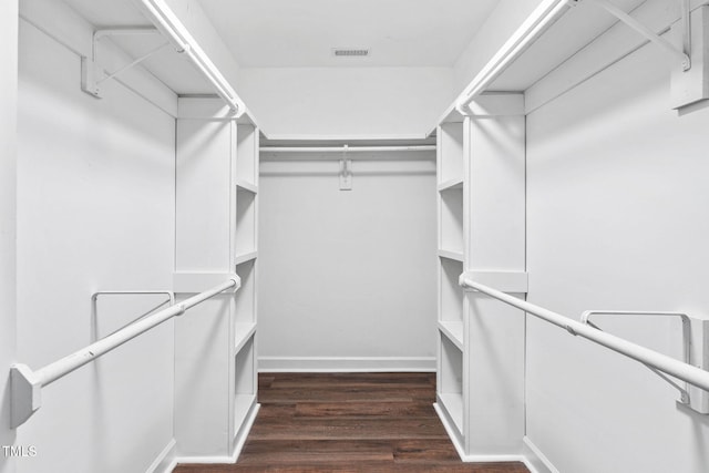 13004 Hanford Ct, Raleigh, NC 27614 - walk in closet featuring dark wood-type flooring