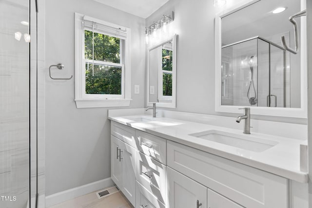 13004 Hanford Ct, Raleigh, NC 27614 - bathroom with double vanity and a stall shower