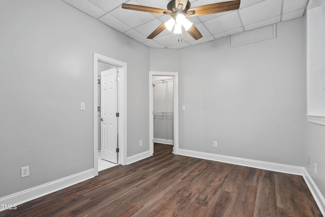 13004 Hanford Ct, Raleigh, NC 27614 - unfurnished bedroom with dark wood-style floors, a drop ceiling, a spacious closet, and ceiling fan