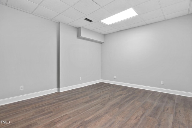 13004 Hanford Ct, Raleigh, NC 27614 - finished below grade area with a paneled ceiling and dark wood-style flooring