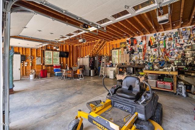 13004 Hanford Ct, Raleigh, NC 27614 - garage with a garage door opener and a workshop area