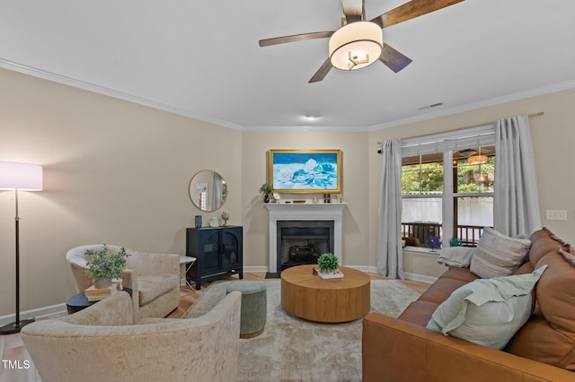 1831 Grandmaster Way, Wake Forest, NC 27587 - living room with ornamental molding, ceiling fan, and a fireplace