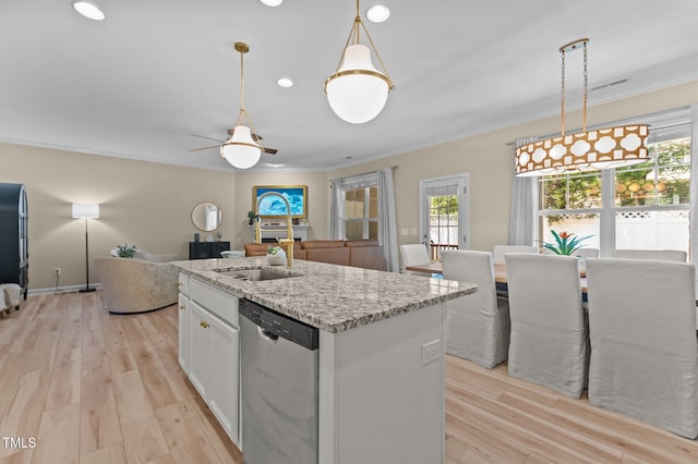 1831 Grandmaster Way, Wake Forest, NC 27587 - kitchen featuring stainless steel dishwasher, ornamental molding, open floor plan, light wood finished floors, and white cabinets