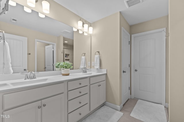 1831 Grandmaster Way, Wake Forest, NC 27587 - bathroom with double vanity and tile patterned flooring